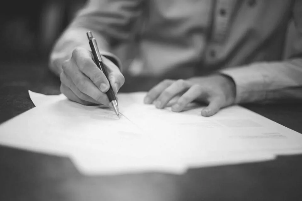 A lawyer signing a document